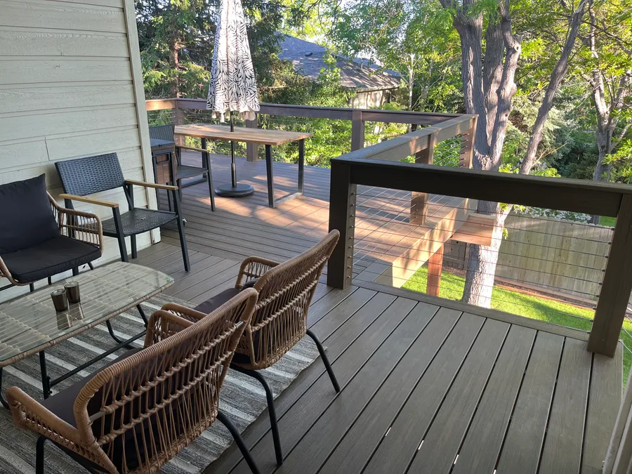 Composite deck with railing and outdoor seating