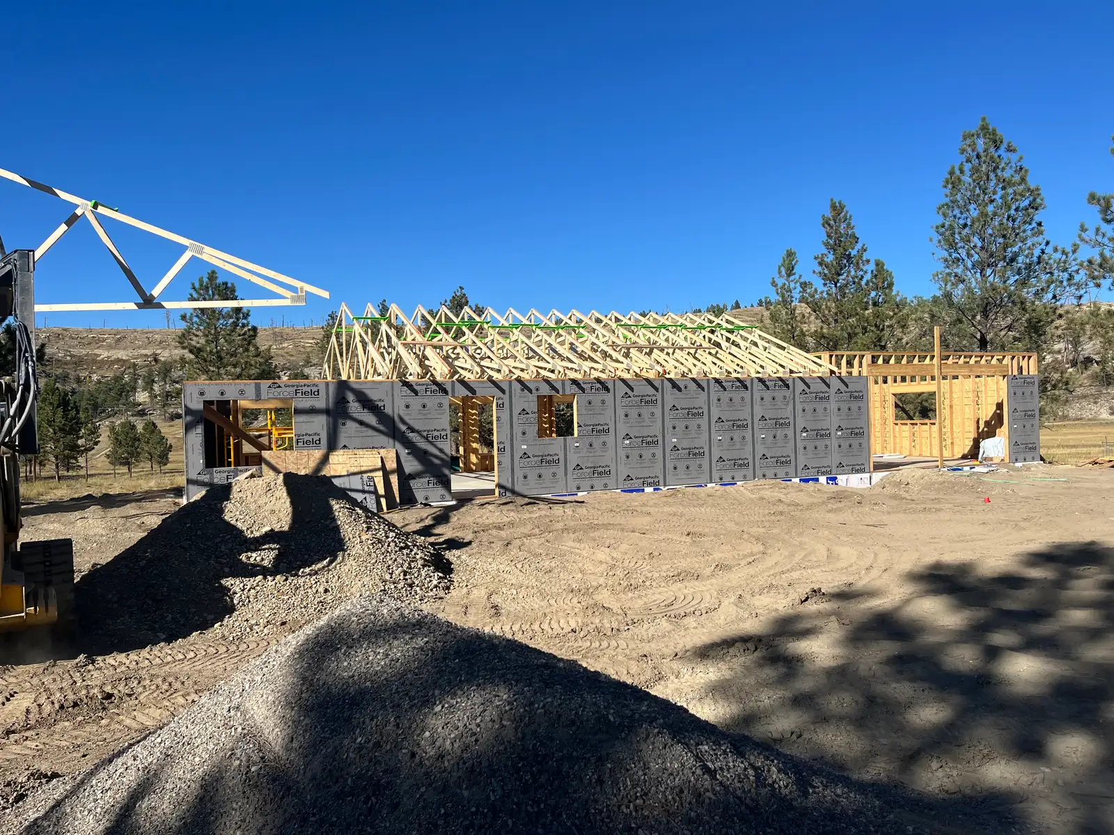 Roof trusses being set on a stick-framed home near Billings, Montana