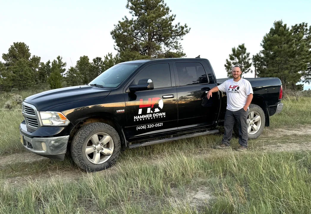 Hammer Down Construction truck on a job site, representing our reliable construction services in Billings and surrounding counties