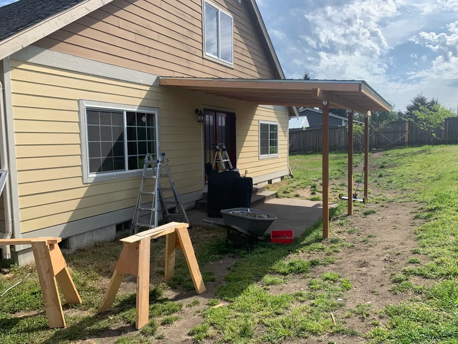 Covered patio addition with new siding on a Montana home